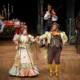 Mr. and Mrs. Fezziwig dance together in A Christmas Carol