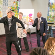 In the foyer of the Buell Theatre, French hip-hop dancer Salah from Breakin’ Convention demonstrates a move as Denver Center CEO Janice Sinden and Denver Mayor Michael Hancock follow along