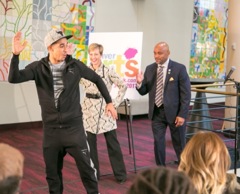 In the foyer of the Buell Theatre, French hip-hop dancer Salah from Breakin’ Convention demonstrates a move as Denver Center CEO Janice Sinden and Denver Mayor Michael Hancock follow along