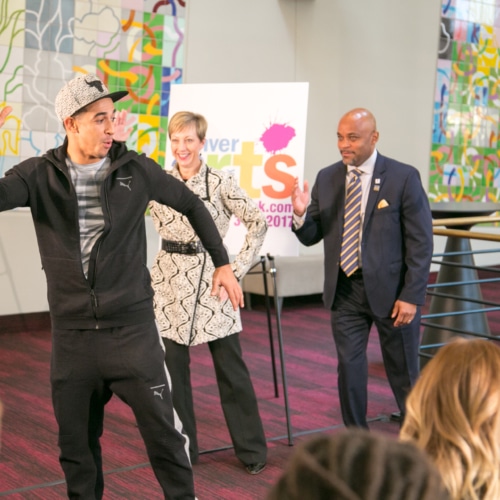 In the foyer of the Buell Theatre, French hip-hop dancer Salah from Breakin’ Convention demonstrates a move as Denver Center CEO Janice Sinden and Denver Mayor Michael Hancock follow along