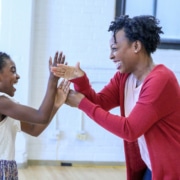 Zaria Kelley and Bianca Laverne Jones play a hand game at the first rehearsal for 'Last Night and the Night Before.' Photo by John Moore for the DCPA NewsCenter.