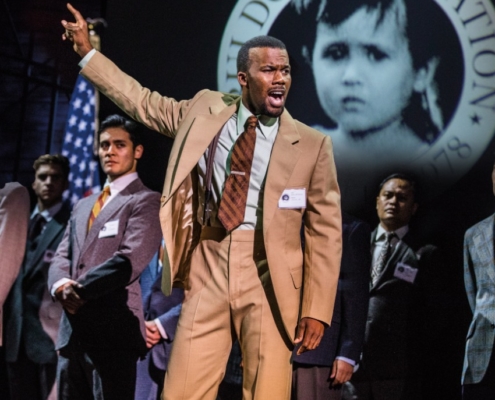 J. Daughtry as ‘John’ and the Company perform “Bui Doi” in the North American Tour of MISS SAIGON. Photo: Matthew Murphy