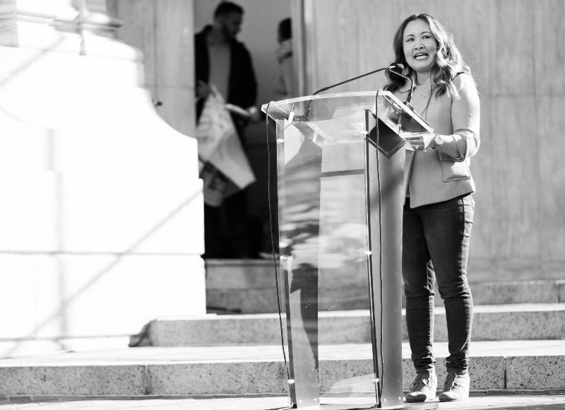 Nga Vuong-Sandoval speaks from the steps of the state capitol at the proclamation of Colorado World Refugee Day. Photo by Daniel Sauve. 