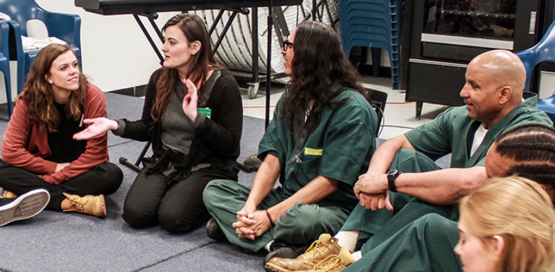 Dr. Ashley Hamilton, second from left, conducts a theatre class at the Sterling Correctional Facility. 