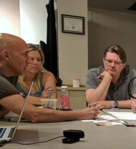 Frim left: Nick Sugar, Linda Morken and Curt Behm in a Town Hall Arts Center production meeting. Photo by Becky Toma. 