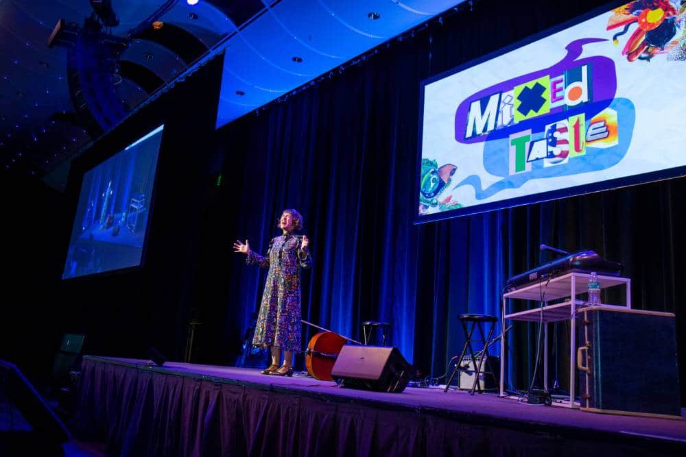 Caption: Neyla Pekarek presenting at Mixed Taste