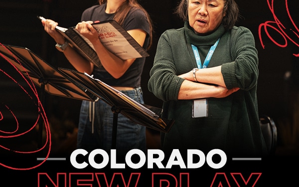 A graphic of two women rehearsing at the Colorado New Play Summit. One reads from a script, the other listens with arms crossed, conveying focus and collaboration. White and red text below reads "COLORADO NEW PLAY SUMMIT."