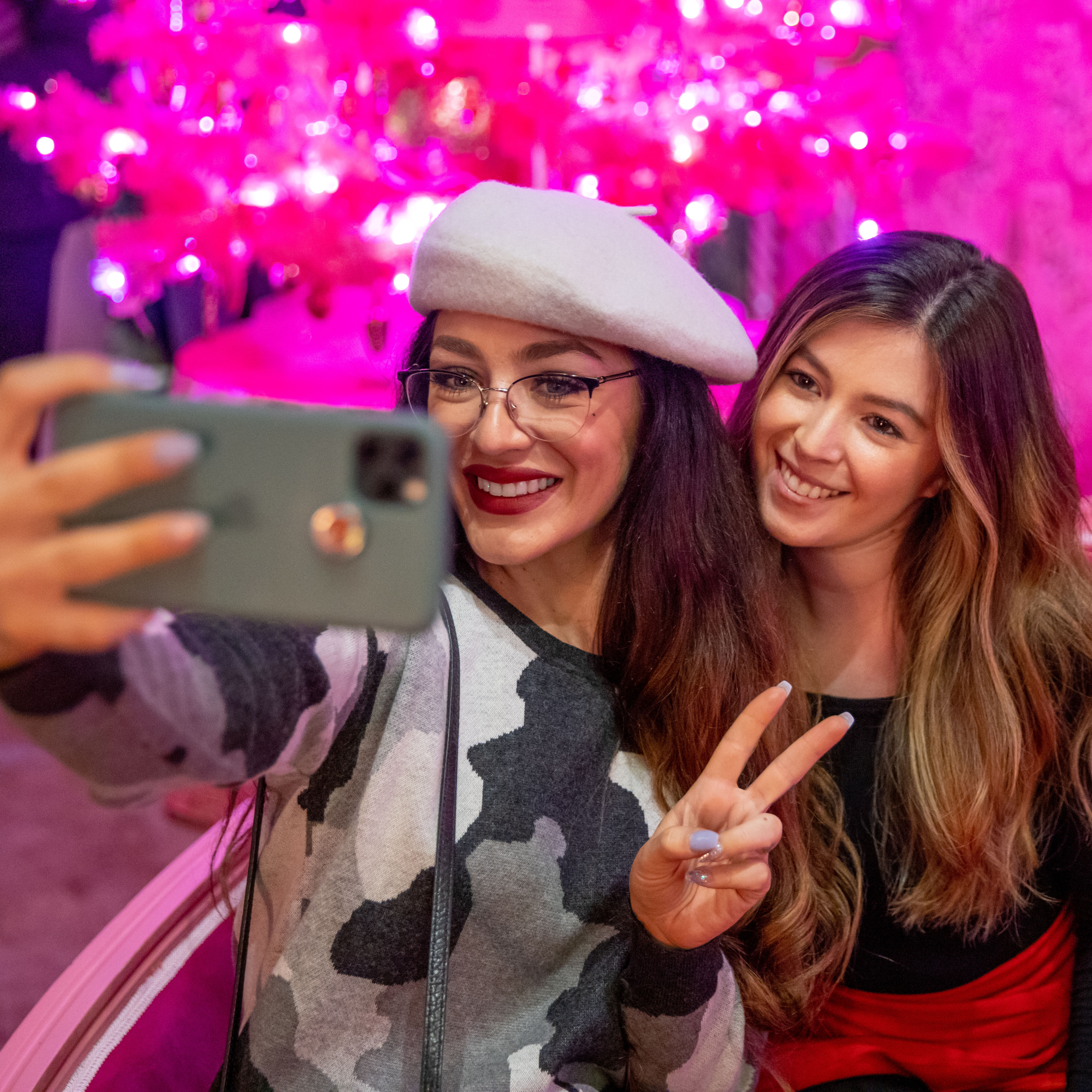 Two women pose for a photo at Camp Christmas