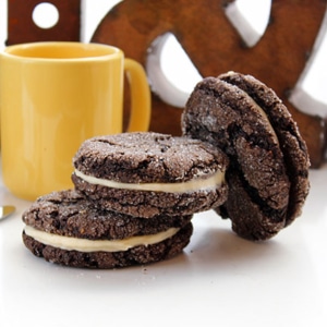 Big “O” cookies made by Olive & Finch arranged in front of a yellow coffee mug