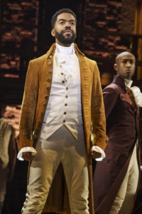 Julius Thomas III as Alexander Hamilton stands onstage in Hamilton Broadway National Tour