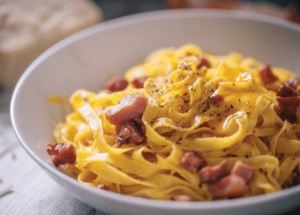 Carbonara pasta in a white bowl