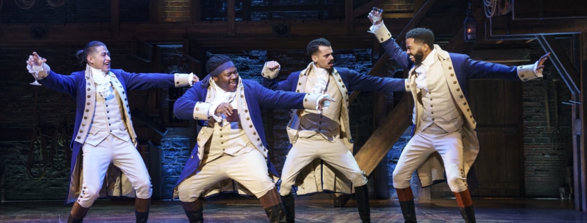 the company of Hamilton Broadway Tour dances onstage