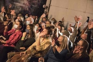 Audience sits watching a show at the Local Theater Company