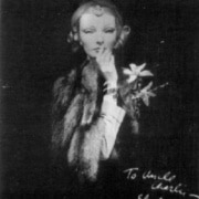 black and white photograph of Betty Pack, codename Cynthia, holding a finger to her lips