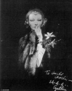 black and white photograph of Betty Pack, codename Cynthia, holding a finger to her lips