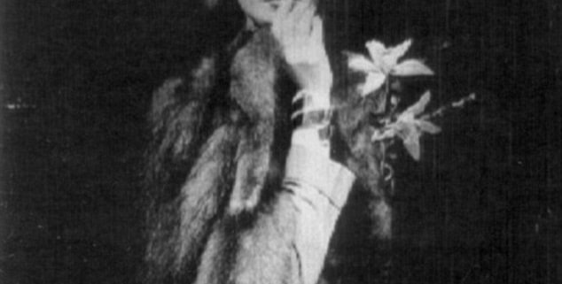 black and white photograph of Betty Pack, codename Cynthia, holding a finger to her lips