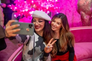 Two women pose for a selfie