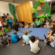DCPA Teaching Artist Rachel Taylor leads a Book Stars workshop with elementary age students