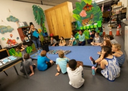 DCPA Teaching Artist Rachel Taylor leads a Book Stars workshop with elementary age students
