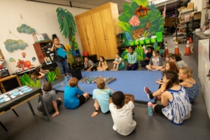 DCPA Teaching Artist Rachel Taylor leads a Book Stars workshop with elementary age students