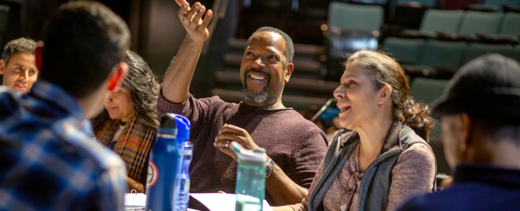 Participants in the Colorado New Play Summit sit at a table