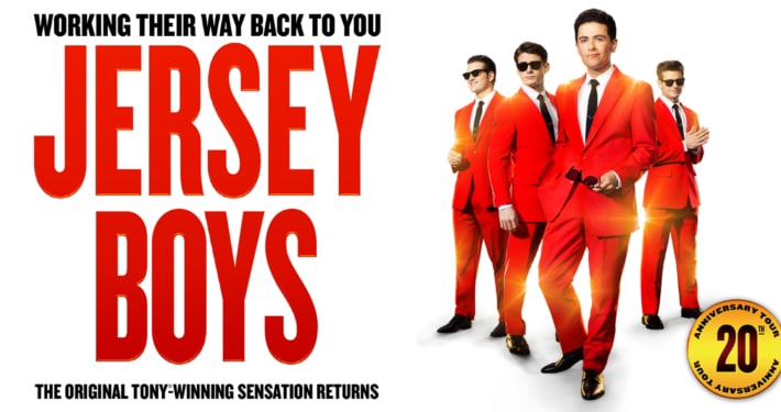 Promotional graphic for Jersey Boys featuring four performers in matching bright red suits and black ties against a white background. Large red text displays the show's title, while smaller text above and below notes the return of the Tony Award-winning musical. A gold emblem in the corner highlights the 20th anniversary tour.