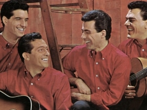 The Four Seasons smile wearing red shirts