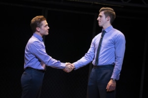 Actors shake hands onstage in Jersey Boys Broadway National Tour