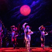 Actors dressed in cat costumes pose while they dance in CATS the musical