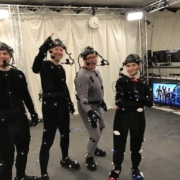 A group of actors wearing MoCap Suits pose for a photo