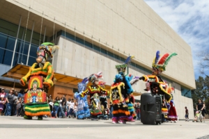 Dancers in colorful costumes perform at Dia del Nino