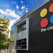 Exterior of The Center with a blue sky in the background