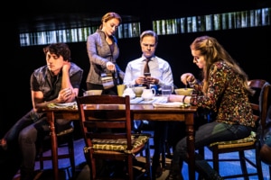 The cast of Dear Evan Hansen sits at a dinner table