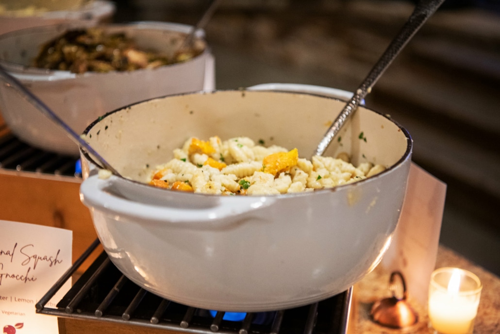 A pot of squash gnocchi sits on a table