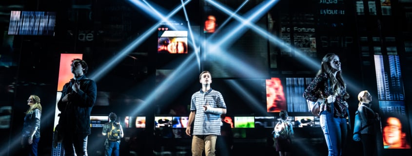 Evan Hansen surrounded by lights and screens in Dear Evan Hansen