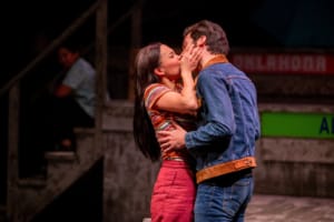 Two actors embrace in a kiss in Vietgone