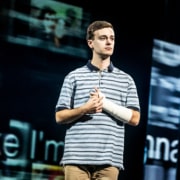 Evan Hansen holds his arm cast close to his chest in Dear Evan Hansen