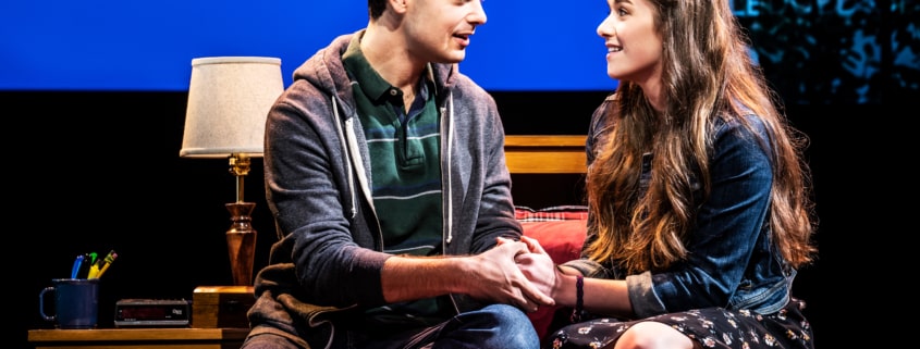 Evan Hansen sits on a bed with Zoe Murphy in Dear Evan Hansen