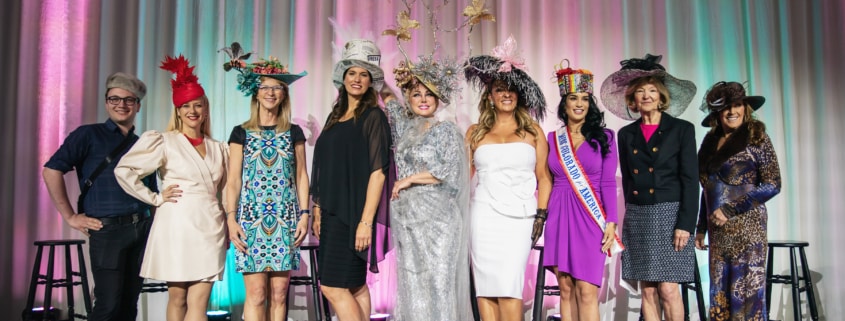 The winners of the Women with Hattitude runway show pose for a photo