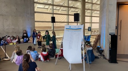 A group of students perform in the Bonfils complex