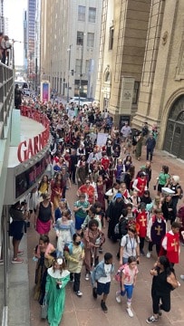 An overhead view of the students marching through the Performing Arts Complex