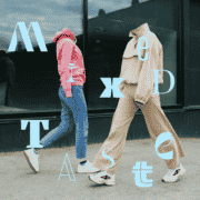 Two headless mannequins posed on a sidewalk