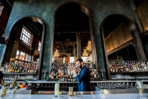 An upscale hotel bar with large mirrors