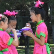 Three children enjoy shaved ice