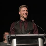 Thomas Beeker stands at a podium