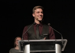 Thomas Beeker stands at a podium