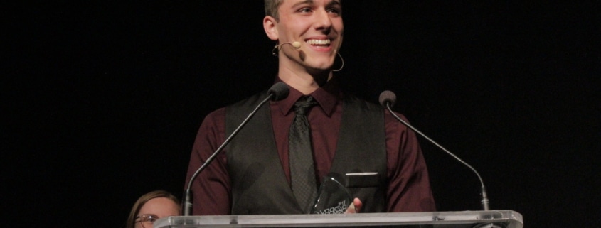 Thomas Beeker stands at a podium