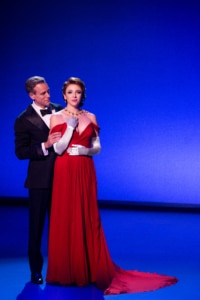 Vivian and Edward stand in a close embrace in Pretty Woman: The Musical