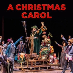 Christmas Carol Cast stand center stage