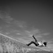 A person falling backwards of a cliff edge